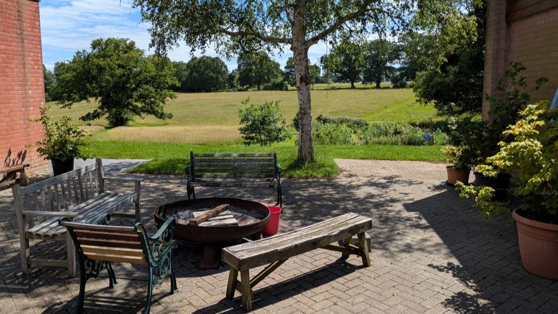 Patio and meadow at Laughton Lodge